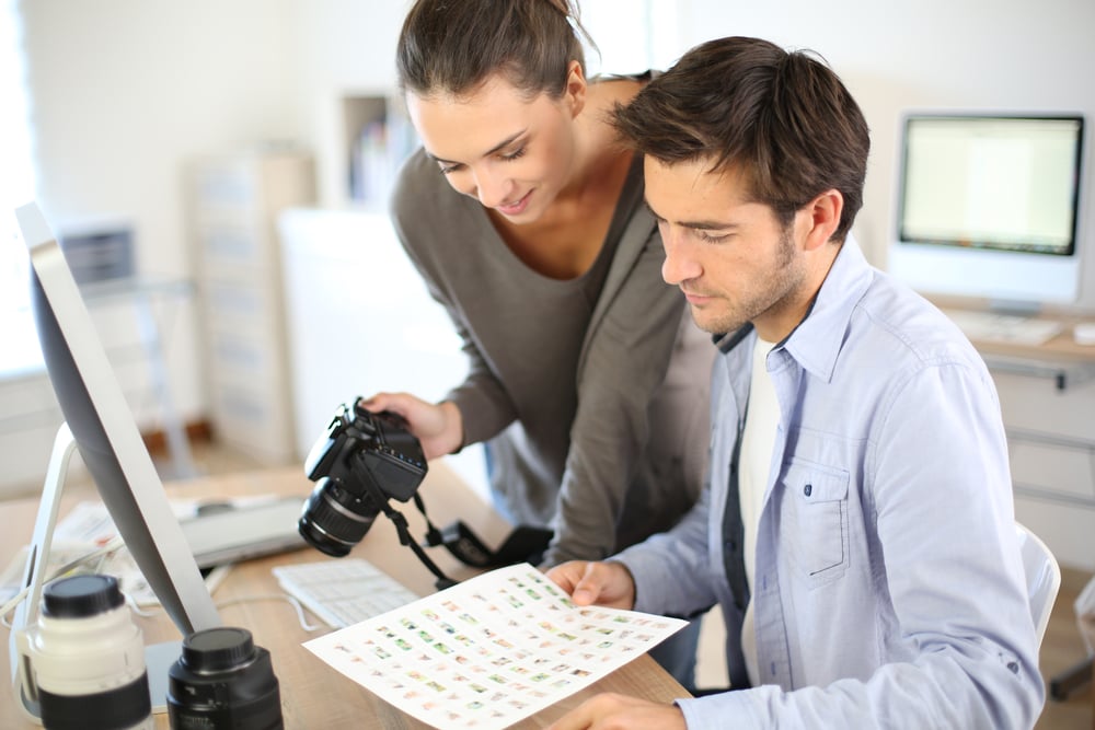 Photo reporters working in office